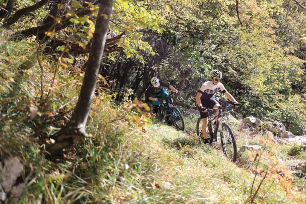 Mountainbiking in Slovenia. MTB trails above Vipava Valley. Couple riding rental mountain bikes by RockVelo.